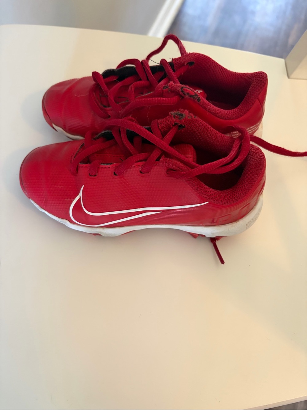 Nike Boys Red baseball cleats with White Swoosh